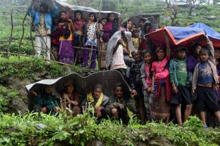 Nepalese villagers shelter from rain, which will only worsen as monsoon season hits. Source: Time Magazine