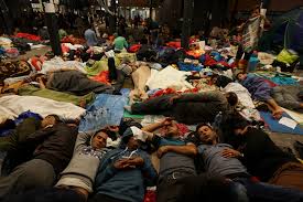 Refugees resting on the floor of the Keleti Railway Station in Budapest, Hungary. Source: Wikimedia Commons