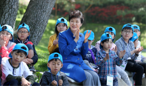 South Korean President Park Geun-Hye celebrates Children’s Day with schoolchildren. Recent government policies have increased childcare infrastructure to decrease the burden of raising a family. Source: Republic of Korea, Flickr.